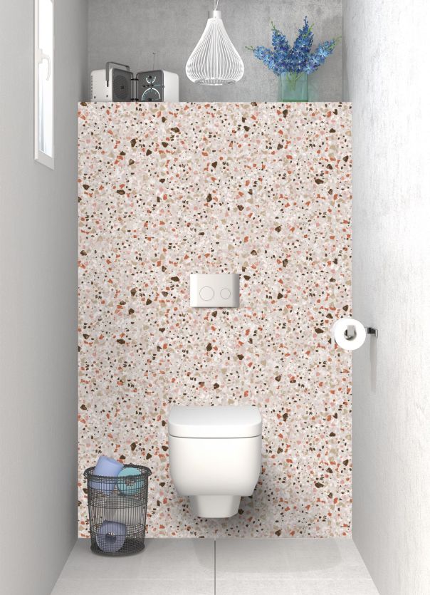 Un effet de style terrazzo pour les toilettes avec imitation éclats de pierre naturelle teintes terracotta